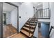 Open staircase featuring wood treads, iron railing, and natural light at 3664 Pin Oak Cir, Atlanta, GA 30340