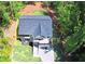 Aerial view of a modern home featuring a dark roof, well-maintained lawn, and driveway at 4366 Bradley Sw Dr, Snellville, GA 30039