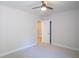 Bright bedroom featuring neutral carpet, ceiling fan, and access to a closet or ensuite bathroom at 4366 Bradley Sw Dr, Snellville, GA 30039