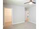Empty bedroom with plush carpet, neutral walls, and a ceiling fan at 4366 Bradley Sw Dr, Snellville, GA 30039