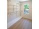 Walk-in closet with a window and wire shelving at 4366 Bradley Sw Dr, Snellville, GA 30039