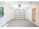 A garage featuring neutral walls, a window, and a white garage door at 4366 Bradley Sw Dr, Snellville, GA 30039