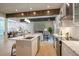 Open-concept kitchen overlooking the living room, with marble countertops and modern appliances at 4366 Bradley Sw Dr, Snellville, GA 30039