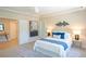 Spacious bedroom features a ceiling fan, soft carpet, and large windows at 4366 Bradley Sw Dr, Snellville, GA 30039