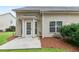 Back patio with a door to the house and a view of the cozy backyard, ideal for entertaining at 184 Darbys Crossing Ct, Hiram, GA 30141
