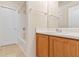 This bathroom includes a shower and tub combo, vanity, and white door at 184 Darbys Crossing Ct, Hiram, GA 30141