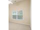 Bright bedroom features a window letting in natural light and neutral carpeting at 184 Darbys Crossing Ct, Hiram, GA 30141