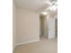 Bedroom with neutral colored walls, carpet, and access to other rooms at 184 Darbys Crossing Ct, Hiram, GA 30141