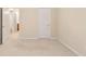 This bedroom offers neutral walls and carpet with an entry way to a bathroom at 184 Darbys Crossing Ct, Hiram, GA 30141