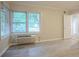 Bedroom with wood-look floors, natural light, and an access door to the hallway at 2046 Rector Sw Dr, Atlanta, GA 30311