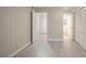 Bright bedroom with wood-look floors and access to the bathroom and hallway at 2046 Rector Sw Dr, Atlanta, GA 30311