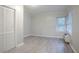 Comfortable bedroom with wood-look floors and a window that fills the room with natural light at 2046 Rector Sw Dr, Atlanta, GA 30311