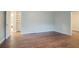 Open bedroom space with hardwood flooring and neutral paint at 2046 Rector Sw Dr, Atlanta, GA 30311
