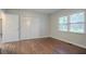 Bedroom featuring hardwood floors, a closet, and a view from the window at 2046 Rector Sw Dr, Atlanta, GA 30311