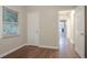 Bedroom featuring hardwood floors, a closet, and a view of the hallway at 2046 Rector Sw Dr, Atlanta, GA 30311