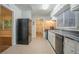 Bright kitchen featuring white cabinets, stainless steel sink, and modern appliances at 2046 Rector Sw Dr, Atlanta, GA 30311
