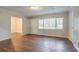 Inviting living room featuring neutral paint, hardwood floors, and bright natural lighting at 2046 Rector Sw Dr, Atlanta, GA 30311