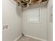 Unfinished basement shows utilities, a window, and unfinished ceiling at 2218 Lowtrail Ct, Lithonia, GA 30058