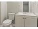 Bathroom featuring a toilet, sink with vanity, and a large mirror at 2218 Lowtrail Ct, Lithonia, GA 30058