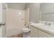 Bathroom features a shower-tub combo, toilet, and single sink vanity at 2218 Lowtrail Ct, Lithonia, GA 30058