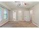 This bedroom has neutral colors, with views to the bathroom and hallway and an abundance of natural light at 2218 Lowtrail Ct, Lithonia, GA 30058