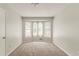This bedroom has neutral colors and lots of natural light from a large bay window at 2218 Lowtrail Ct, Lithonia, GA 30058