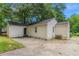 Back exterior of the home, featuring a concrete patio and siding at 2239 Carey Se Dr, Atlanta, GA 30315