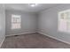 Bedroom featuring plush carpeting and two windows offering natural light at 2239 Carey Se Dr, Atlanta, GA 30315