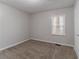 Bedroom with neutral walls and plush carpet with a bright window at 2239 Carey Se Dr, Atlanta, GA 30315