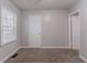 Neutral bedroom with carpet, window, and white painted walls at 2239 Carey Se Dr, Atlanta, GA 30315