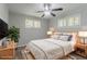 Bedroom showcasing neutral walls, plush carpet, ceiling fan and two bright windows at 2239 Carey Se Dr, Atlanta, GA 30315