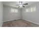 Cozy bedroom featuring plush carpet, neutral walls, and a ceiling fan at 2239 Carey Se Dr, Atlanta, GA 30315