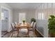 Elegant dining room featuring modern decor, a stylish rug, and ample seating at 2239 Carey Se Dr, Atlanta, GA 30315