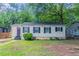 Charming home featuring symmetrical window shutters and a well-kept front lawn at 2239 Carey Se Dr, Atlanta, GA 30315