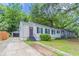Inviting home boasting a concrete driveway, manicured lawn, and tasteful curb appeal at 2239 Carey Se Dr, Atlanta, GA 30315