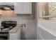 Well-lit kitchen featuring overhead cabinets and an adjacent door and window at 2239 Carey Se Dr, Atlanta, GA 30315