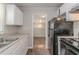 Functional kitchen showcasing essential appliances and an open view to the living area at 2239 Carey Se Dr, Atlanta, GA 30315