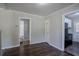 Open-concept living room featuring hardwood floors and access to the kitchen at 2239 Carey Se Dr, Atlanta, GA 30315