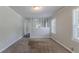 Spacious living room featuring neutral-toned walls, carpets, and ample natural light at 2239 Carey Se Dr, Atlanta, GA 30315