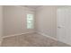 Bright bedroom with neutral walls, carpet, and window at 2378 Randall Ave, Lithonia, GA 30058