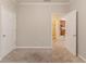 Bedroom with carpeting and view of kitchen through doorway at 2378 Randall Ave, Lithonia, GA 30058