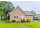 Charming one-story home with light pink siding, stone accents, and a well-manicured green lawn at 2378 Randall Ave, Lithonia, GA 30058