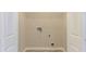 White laundry room with white wire rack and tiled floors at 2378 Randall Ave, Lithonia, GA 30058