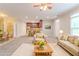 Staged living room showing open floor plan to kitchen with eat-in bar and dining area at 2378 Randall Ave, Lithonia, GA 30058