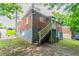 This backyard shows an exterior with stairs leading to the second level at 2817 Burton Nw Rd, Atlanta, GA 30311