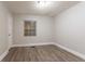 Bright bedroom features neutral colors, light-colored floors, and a window at 2817 Burton Nw Rd, Atlanta, GA 30311