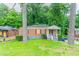 Charming single-story brick home with a front porch and landscaped yard at 2817 Burton Nw Rd, Atlanta, GA 30311