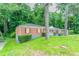 View of the home's exterior and surrounding green lawn at 2817 Burton Nw Rd, Atlanta, GA 30311