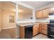 View of the kitchen with wood cabinets at 2817 Burton Nw Rd, Atlanta, GA 30311