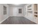 Unfurnished living room features neutral colors, and modern gray floors at 2817 Burton Nw Rd, Atlanta, GA 30311